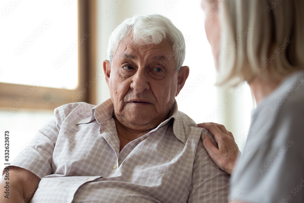 Middle-aged woman supporting upset older man close up, touching shoulder, expressing love and empathy, adult daughter helping elderly father to overcome problems, caregiver consoling senior patient Middle-aged woman supporting upset older man close up, touching shoulder, expressing love and empathy, adult daughter helping elderly father to overcome problems, caregiver consoling senior patient