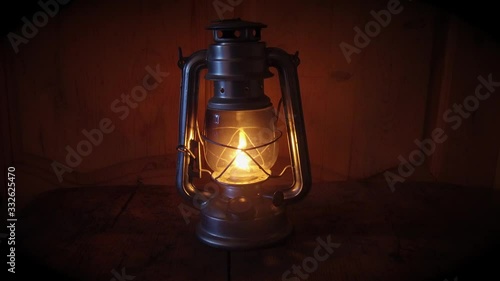an old kerosene lamp on a wooden table