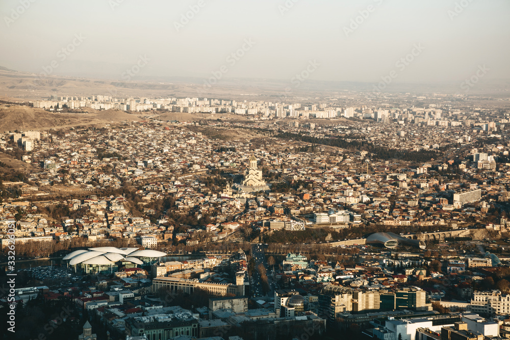 Beautiful aerial view of Tbilisi architecture in Georgia at sunset.