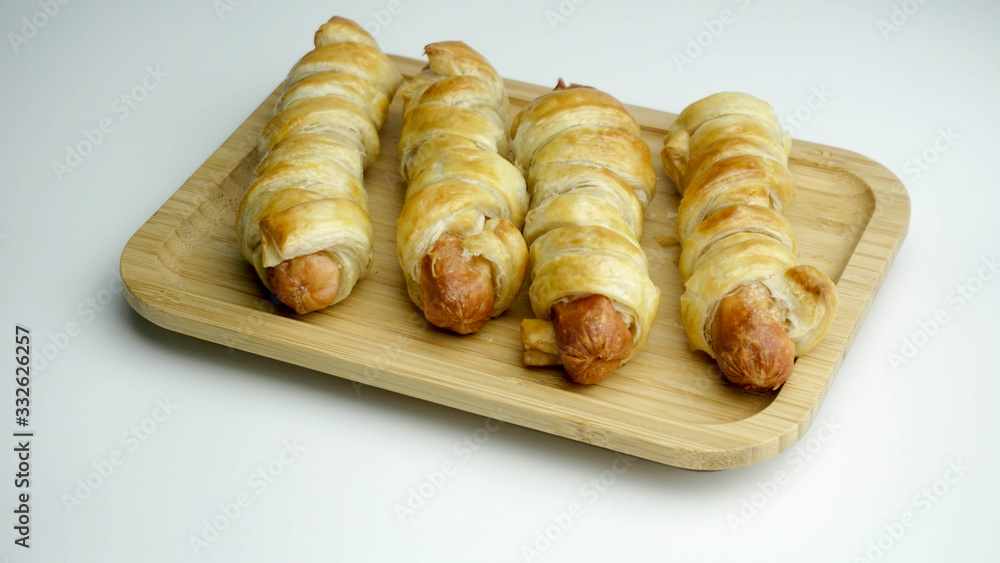 sausage rolls baked in dough. Isolated white background with clipping path sausage rolls baked in dough. Isolated white background with clipping path