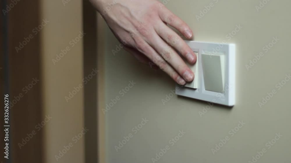 Switching off lights to save electricity at home, closeup Switching off lights to save electricity at home, closeup
