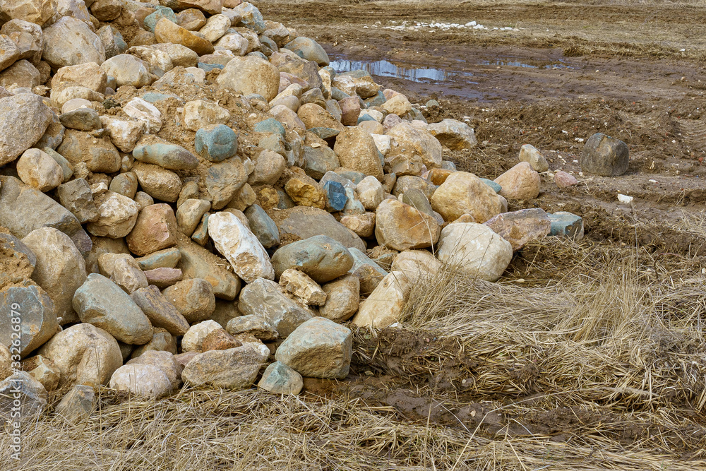 pile of cobblestones with sand