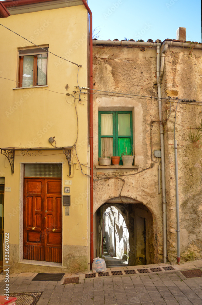 Oliveto Citra, Italy, 04/08/2017. A narrow street between old buildings of a medieval village.