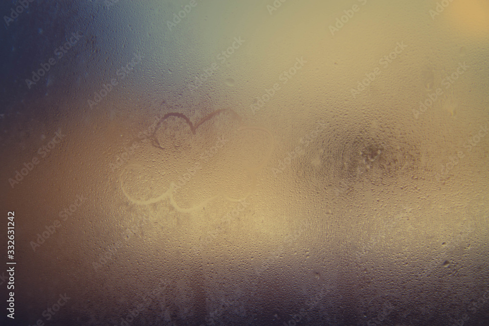 Wet and warm weather. Raw glass, raindrops, image of a cloud.