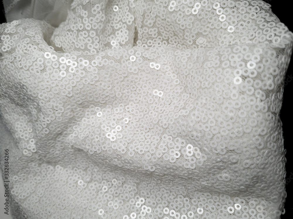 Fototapeta premium close up on shiny bridal white round sequin fabric texture detail 