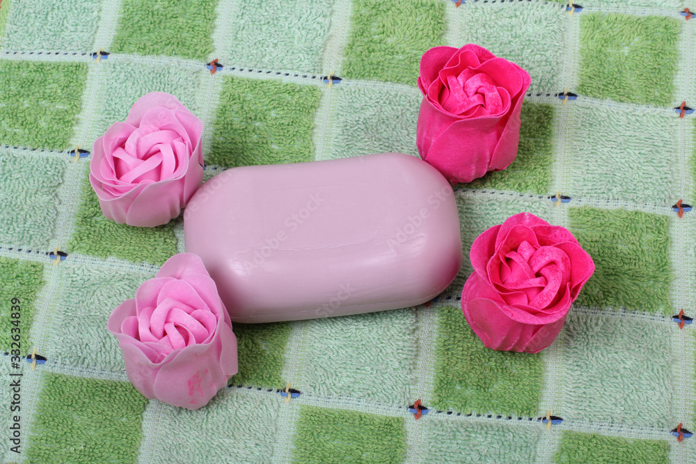 Soap in form of rose buds on a soft large towel Soap in form of rose buds on a soft large towel