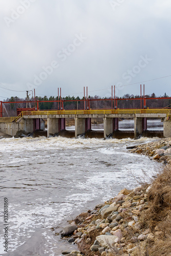 hydraulic structure  a dam through which a river flows