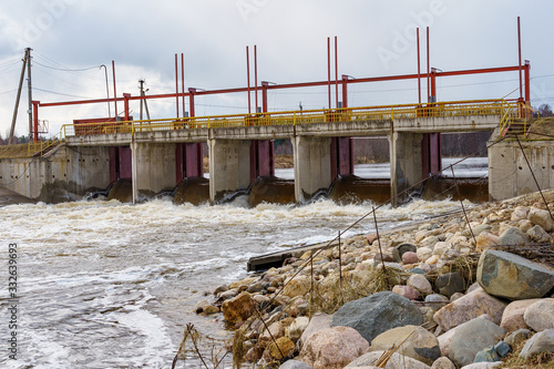 Obraz na płótnie hydraulic structure, a dam through which a river flows w salonie