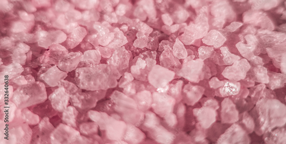 Fototapeta premium Sea salt close up as illustration of relaxing aromatherapy spa and grainy pink texture background backdrop