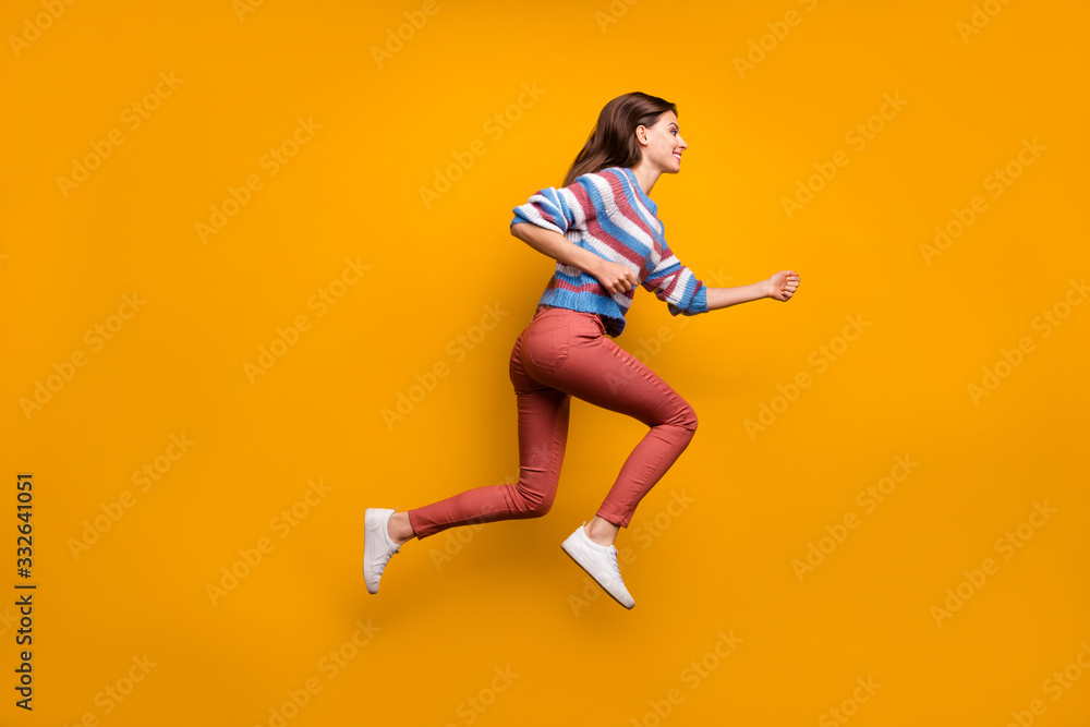 Full size profile side photo of content lovely youth girl jump run after fall bargain novelties wear good look clothes pullover shoes isolated over bright color background