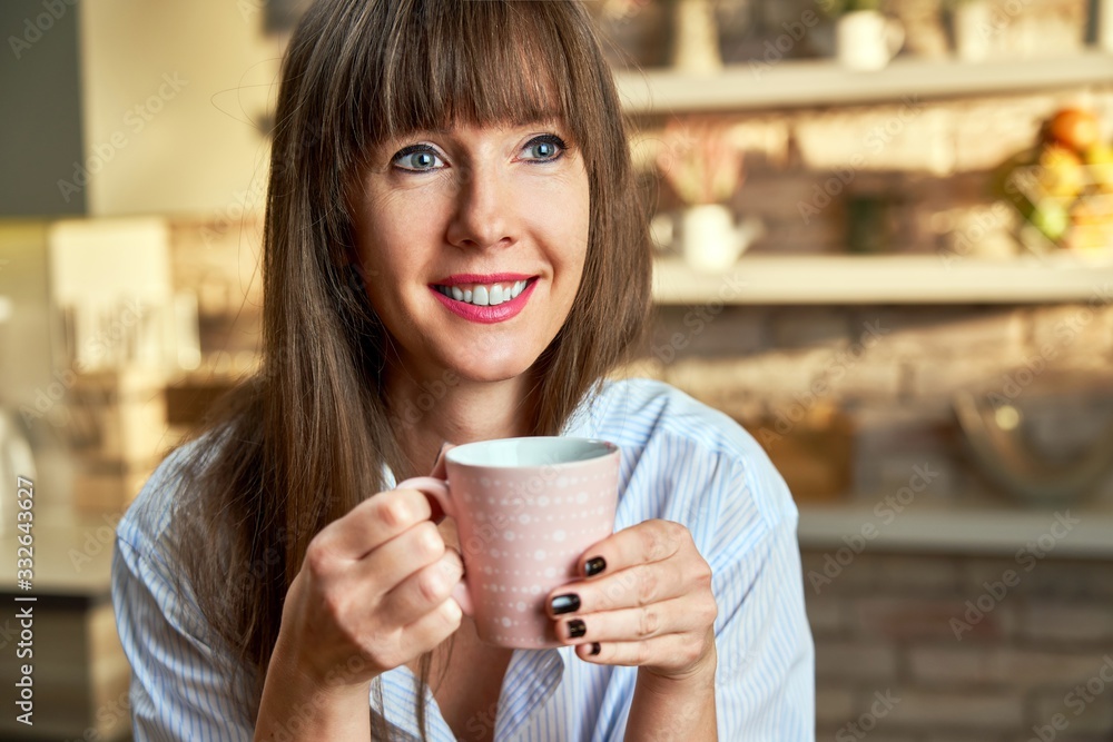Happy woman at home drinking coffee at morning Happy woman at home drinking coffee at morning