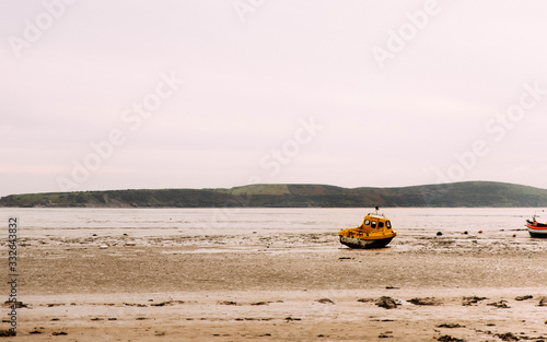 Lonely boat waiting for a tide