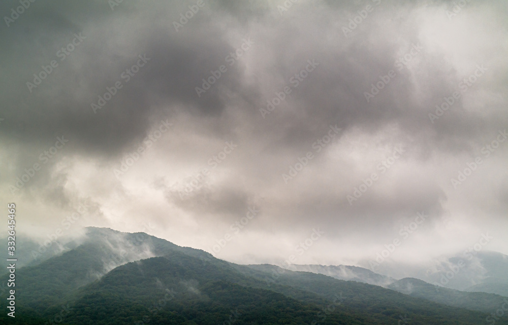dark cloud and scenery raining on high mountain