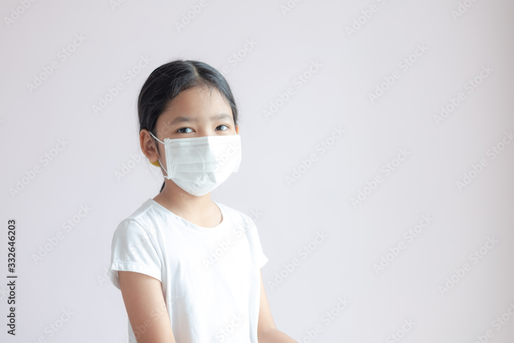 Portrait of little Asian girl wears a medical protective mask. Portrait of little Asian girl wears a medical protective mask.
