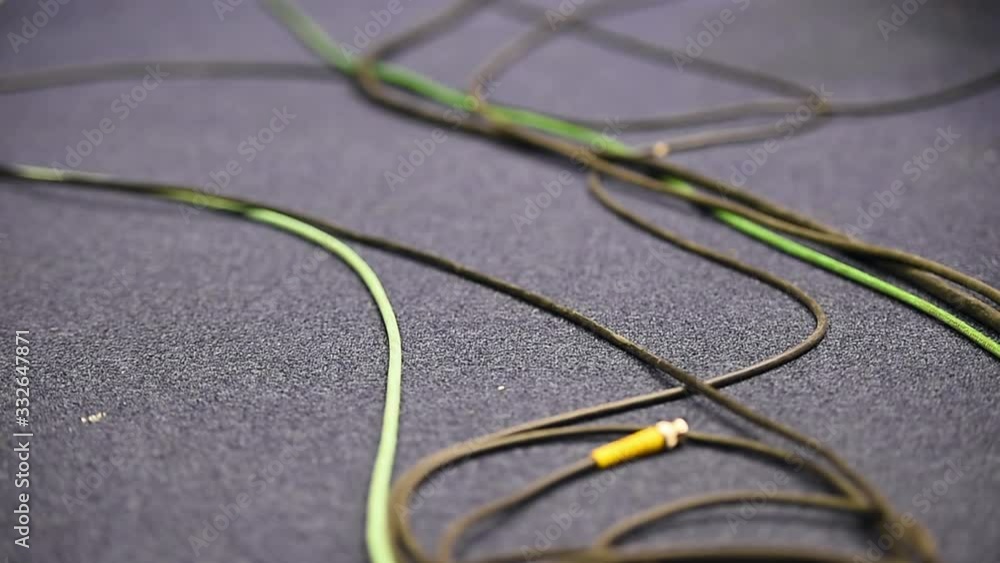 Focus changes on lots of tangled television cables Focus changes on lots of tangled television cables