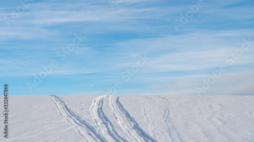 Landscape of snow covered countryside with beautiful sky