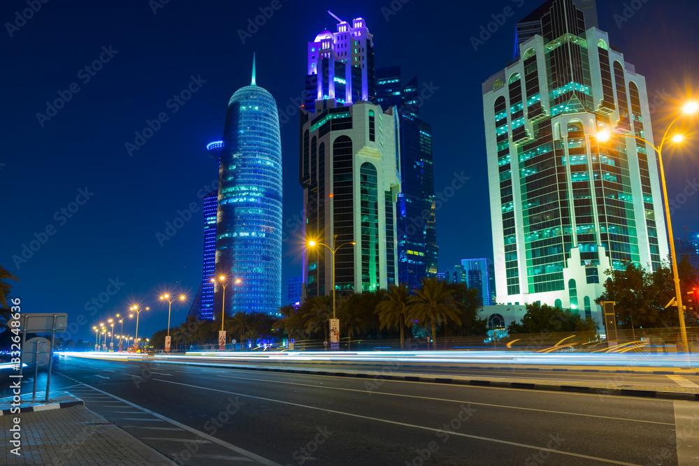 Fototapeta premium Night urban skyline of modern skyscrapers in Financial District in Doha, Qatar