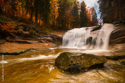 Autumn, colorfull shot of Mumlavsky waterfall on Mumlava River located in Giant Mountains photo