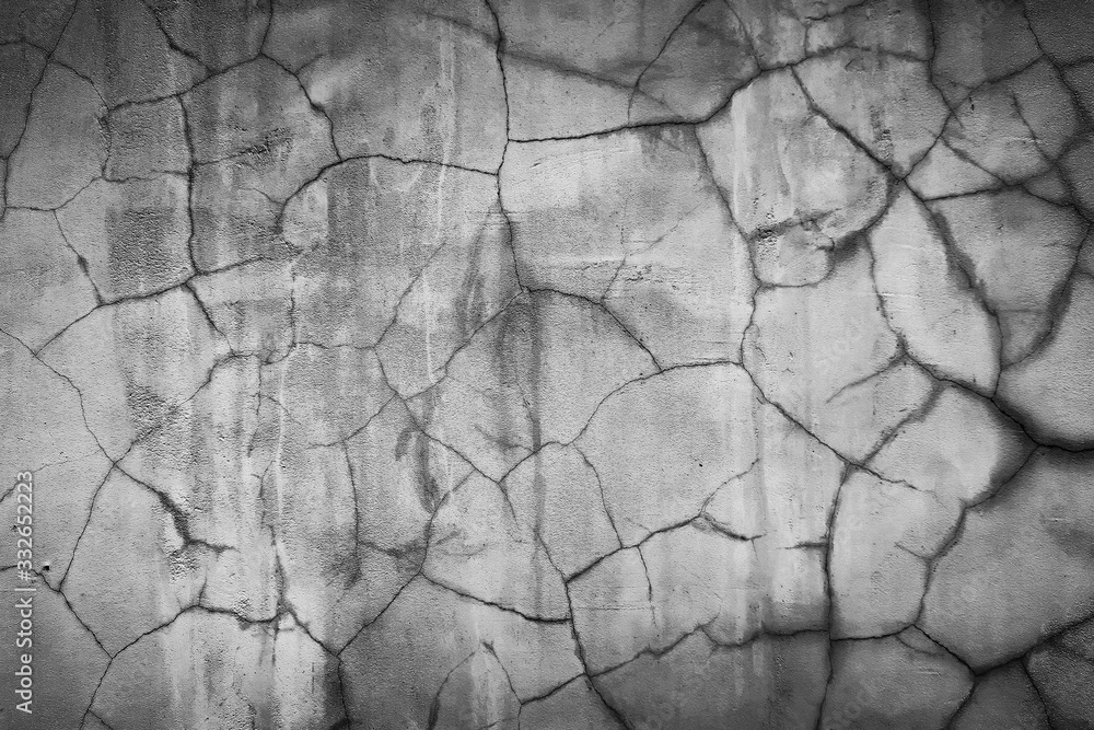 Background texture of an old concrete wall with cracks Background texture of an old concrete wall with cracks