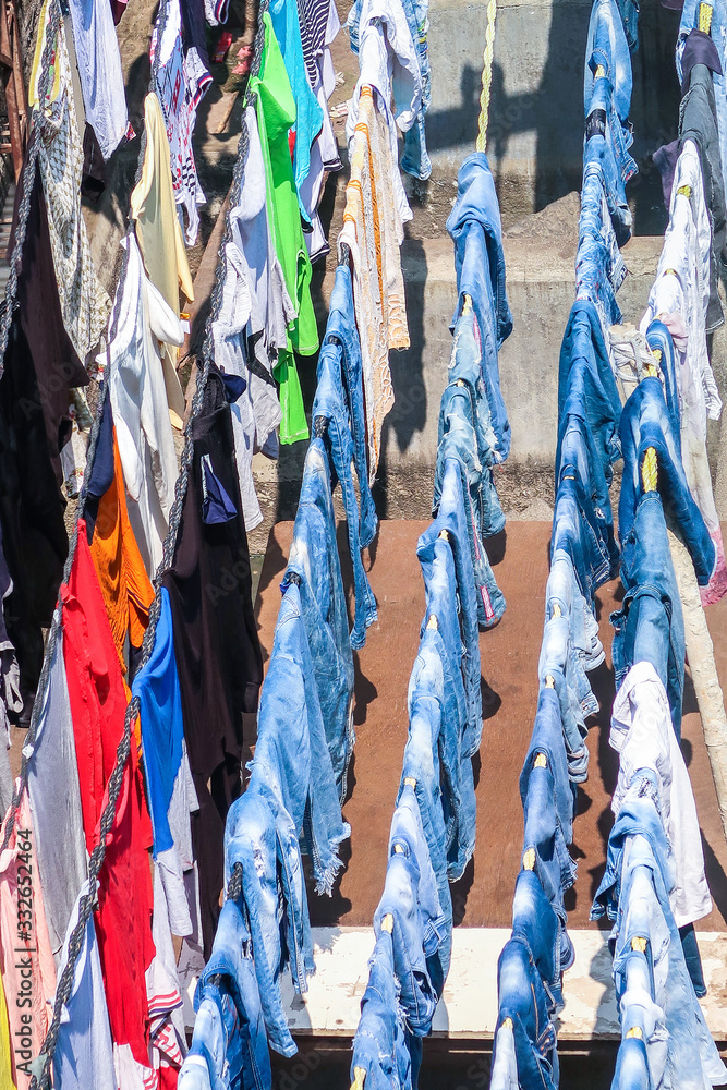 Clothes hanging out on rope to dry