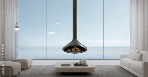 Luxury beach house.Sofa,chair,table,lamps,curtains in living room with infinity edge swimming pool and sea view outside.Vacation home or holiday villa.3d rendering