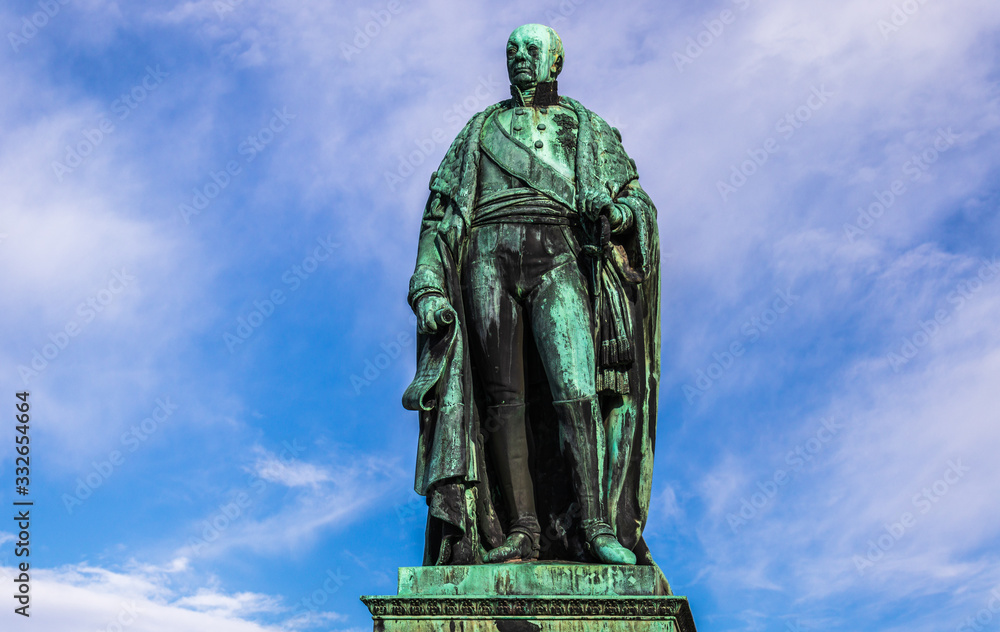Details of Monument of Karl Friedrich von Baden with blue sky in background. Near Castle Karlsruhe, Baden-Wuerttemberg, Germany