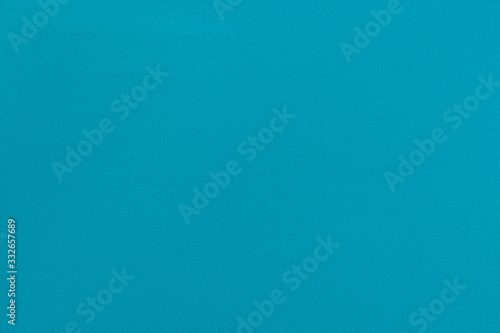 Blue homogeneous background with a textured surface, fabric.