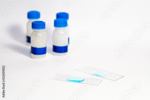 Laboratory samples. Analysis of viruses and diseases. Epidemic cure. Coronavirus and health. White background. Scientific work.