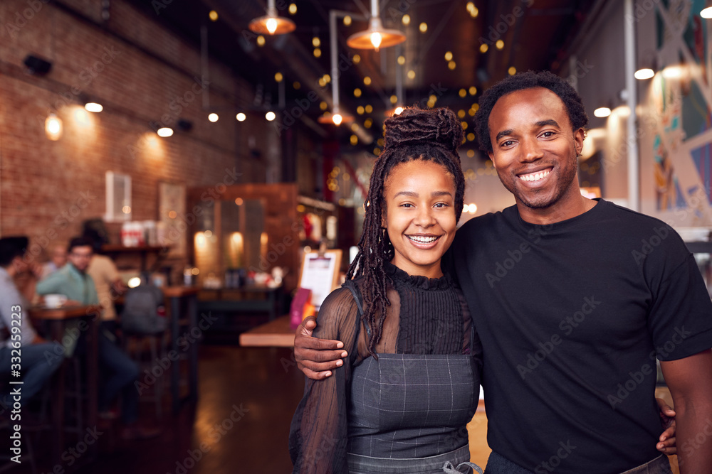 Couple Meeting And Chatting In Coffee Shop Sitting At Table