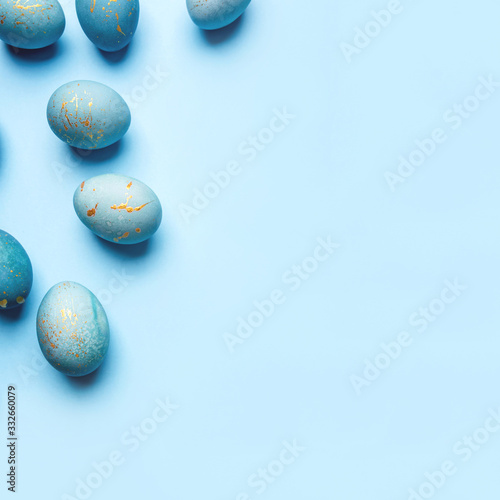 Easter background of eggs painted in blue color. Flat lay  top view.