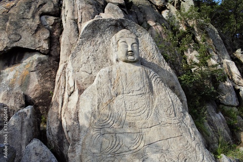 Buddha relief carved into stone on Namsan, Gyeongju, Korea photo