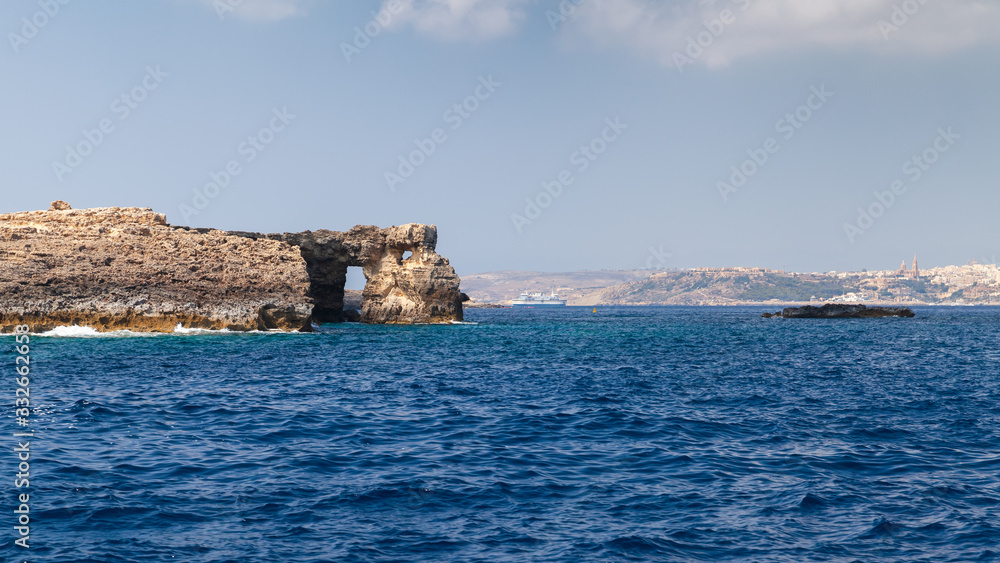 Natural stone arch on a coast of Comino island, Malta