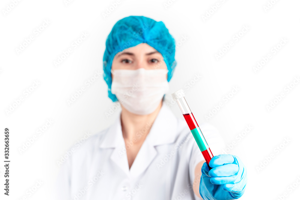 young woman doctor is holding a blood test in her hand. Health concept on white background.