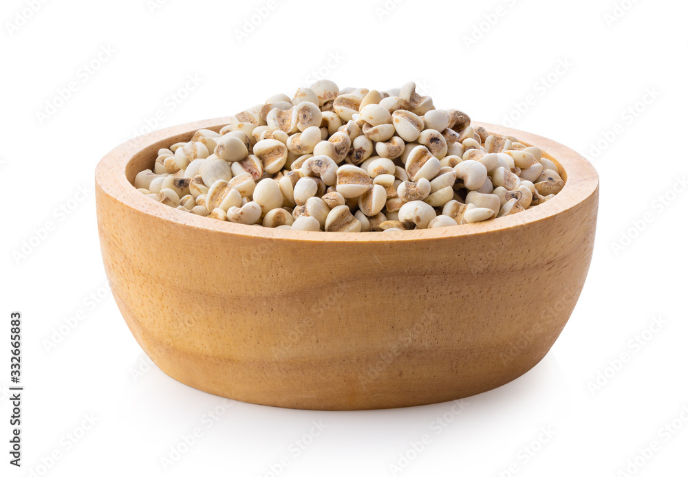 Pile of Adlay millet ( pearl millet or Job's tears ) in wood bowl on
