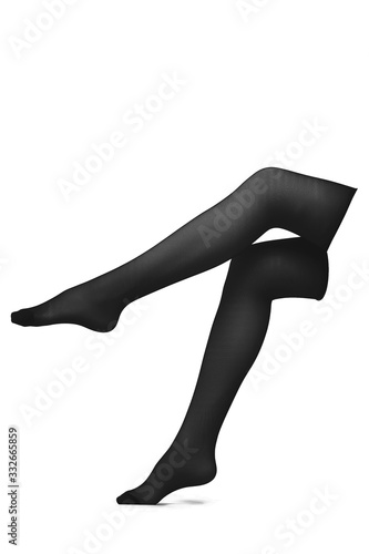 Subject shot of black nylon stockings without a design. One of female legs is raised up, the other one is on tiptoe. The photo is made on the white background.