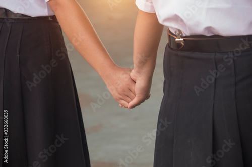 Student shake hands to express love