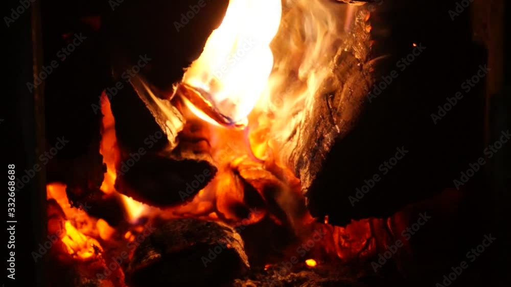Fire in the stove. The old stove. Village stove. The flame of fire in the furnace. Burning firewood. Red fire. Fire in the stove. The old stove. Village stove. The flame of fire in the furnace. Burning firewood. Red fire.