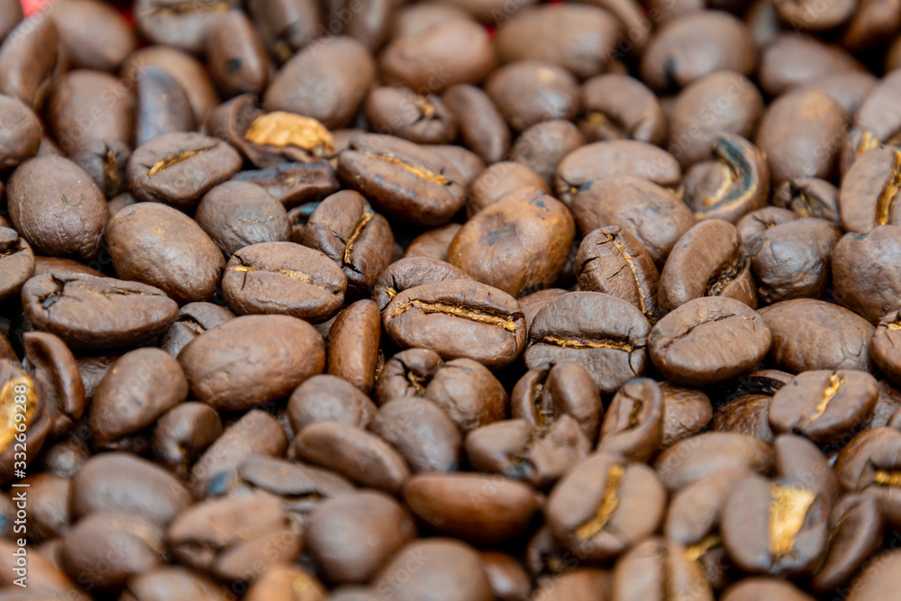 Close up of dark coffee beans dark roasted seeds Close up of dark coffee beans dark roasted seeds