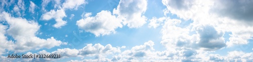 gorgeous panorama of cloudscape in springtime. weather background with dynamic cloud arrangement on a blue sky. sunny and windy day  good weather forecast concept