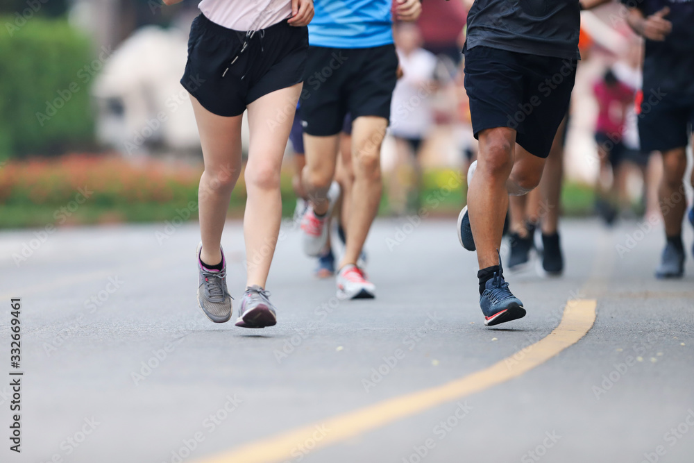 Group of people running race marathon