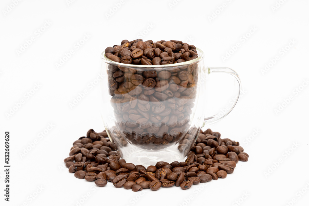 Glass thermos insulating cup transparent filled with and between coffee beans Glass thermos insulating cup transparent filled with and between coffee beans
