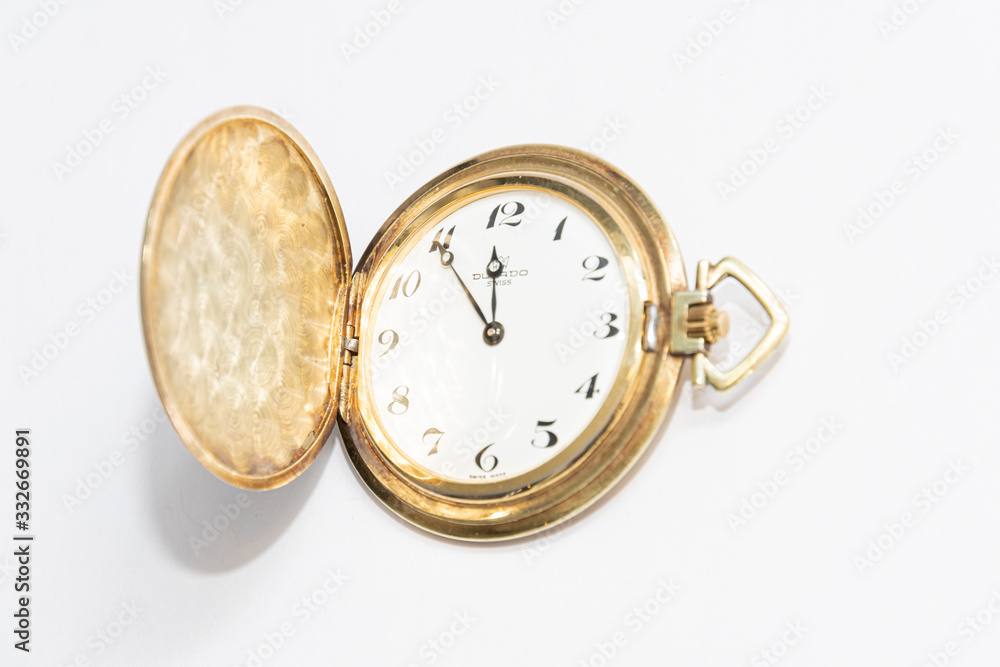 Old golden pocket watch manufactured in switzerland colored golden five minutes to midnight