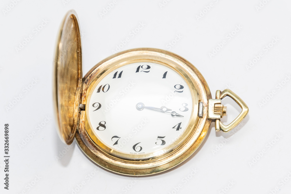 Old golden pocket watch manufactured in switzerland colored golden Old golden pocket watch manufactured in switzerland colored golden