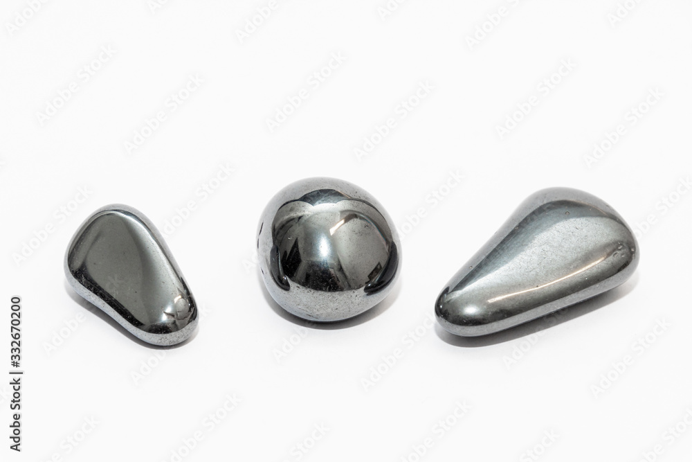 Three metallic looking round and highly polished rare gemstones Three metallic looking round and highly polished rare gemstones