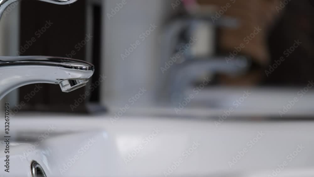 Washing female hands throughly with soap, profile close up Washing female hands throughly with soap, profile close up