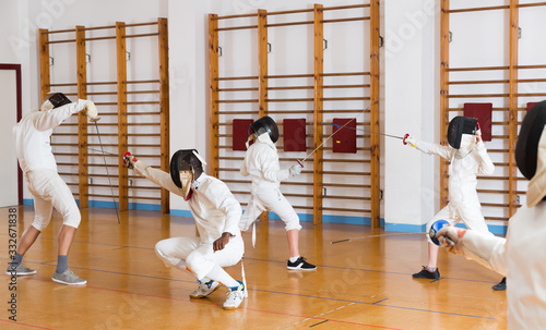  fencers practicing rapier blows in pairs