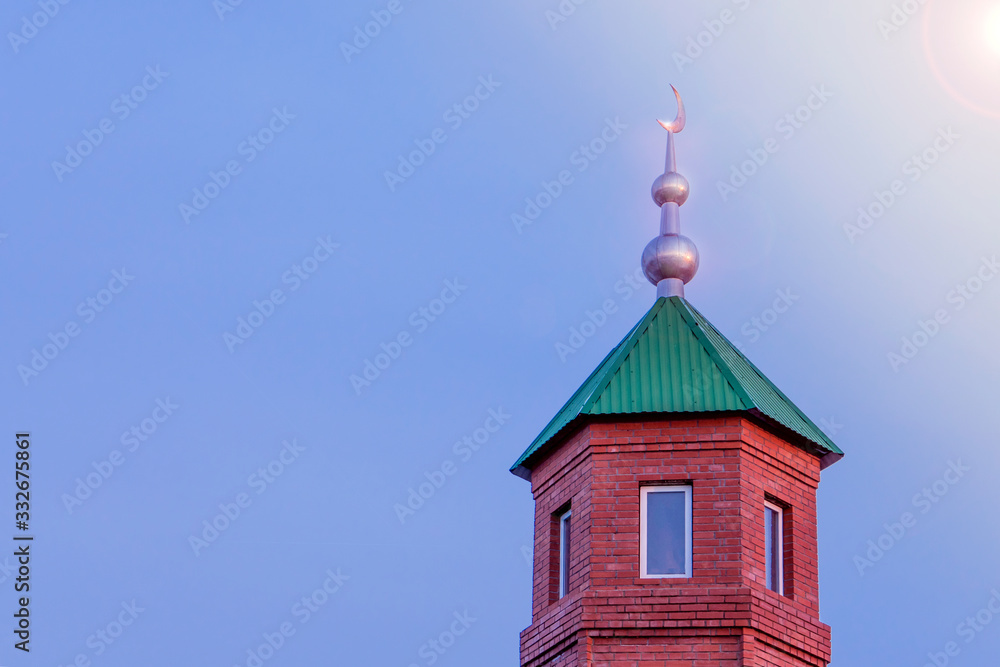 Dome of a mosque against blue sky and lots of copy space for text