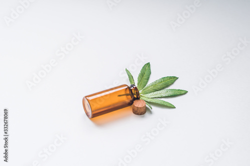 Marijuana in a glass stash jar. Isolated on white. Room for text. Shallow depth of field. Hand made fake Cannabis.
