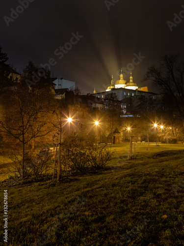 фотографія Church of Saint Michael in Olomouc with a park allay at night