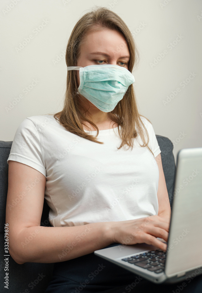 Woman in medical mask working from home. Isolation at home. Woman in medical mask working from home. Isolation at home.